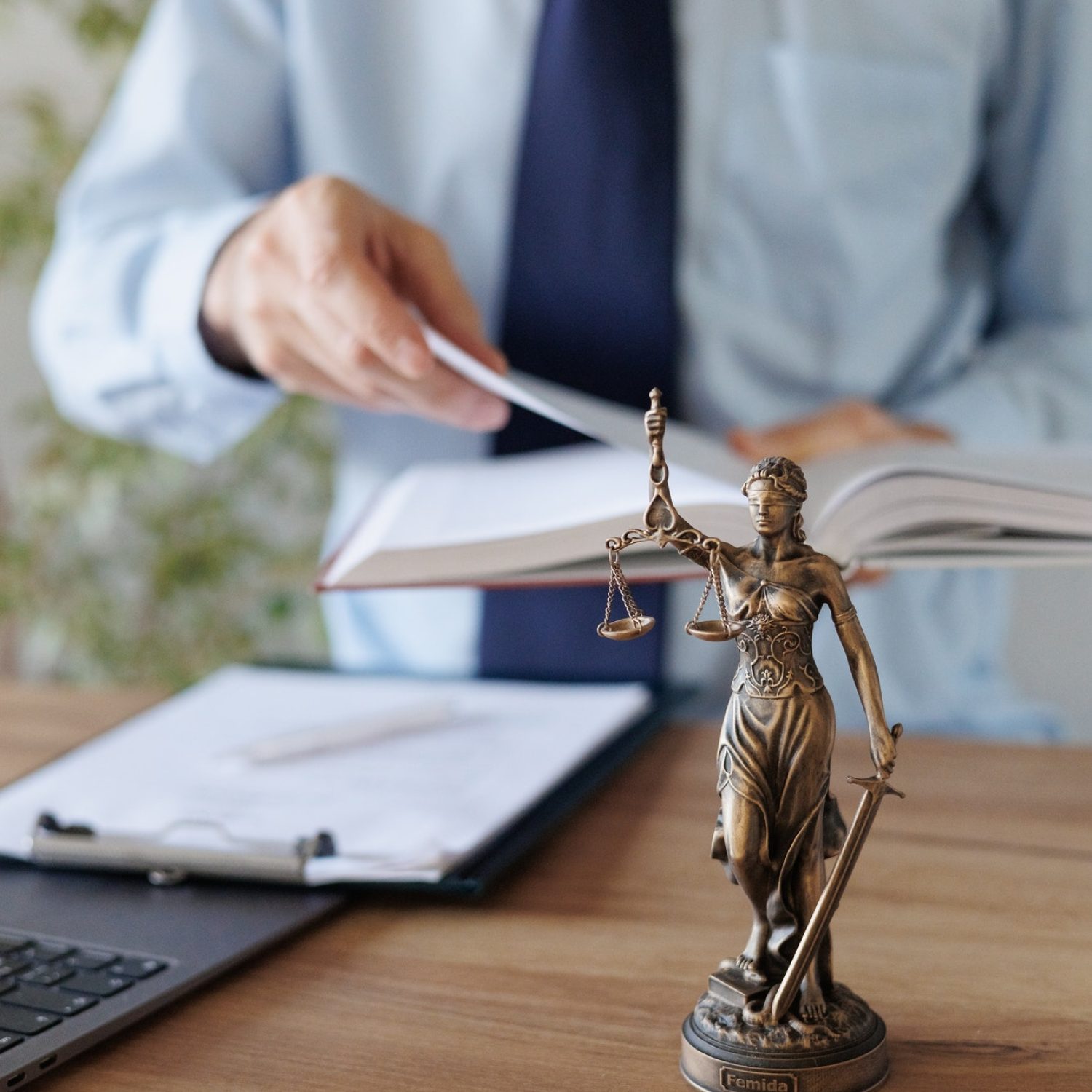 a-male-lawyer-in-a-blue-shirt-and-tie-in-the-office-legal-advice-in-the-office-or-online-.jpg